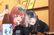 a bottle of genn sits next to two girls
