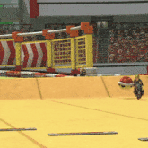 a person riding a motorcycle on a track with a sign that says ' nintendo fun ' on it