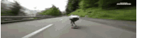 a person is riding a skateboard on a highway .