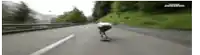 a person is riding a skateboard on a highway .