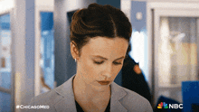 a woman in a suit is on a nbc ad for chicagomed