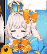 a girl with a crown on her head is wearing a blue dress