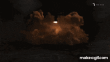 a nuclear explosion is shown on make a gif .com