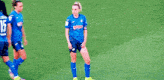 a group of women are playing soccer on a field and one of them is wearing a blue jersey that says banco