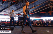 a wrestling ring with a sign that says wwe network