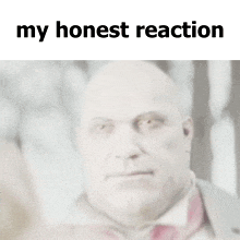a blurred image of a man with the words " my honest reaction " below him
