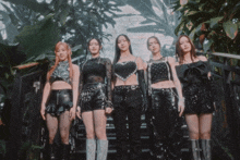 a group of girls standing on a set of steps