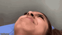 a close up of a woman 's face with imgflip.com at the bottom of the image