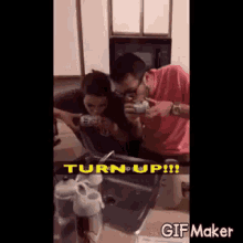 a man and a woman are taking a picture of themselves in front of a mirror .