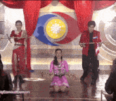 a group of people are performing on a stage with the words carnival concert below them