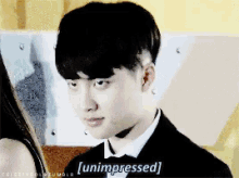 a man in a tuxedo says [ unimpressed ] in a pixelated image