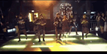 a group of people are dancing on a dance floor and one of them is wearing a shirt that says ' dirty ' on it