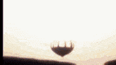 a person 's feet are shown standing on top of a hill