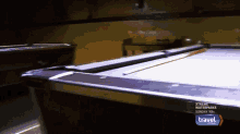 a pool table is shown in a travel channel ad