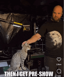 a man petting a cat with the caption then i get pre show