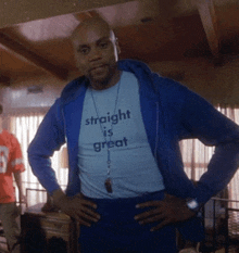 a man wearing a shirt that says " straight is great "