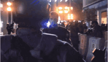 a man standing in front of a crowd with a sign that says ' n.y.c.p. ' on it