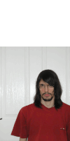 a man with long hair and glasses wearing a red t-shirt