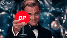 a man in a tuxedo is pointing at a red circle that says op on it