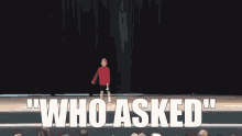 a young boy is standing on a stage with the words who asked behind him