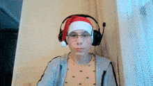 a person wearing a santa hat and headphones