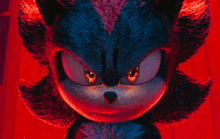 a close up of shadow the hedgehog 's face with glowing eyes