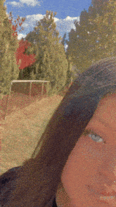 a close up of a woman 's face with a blurred background