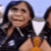 a blurry picture of a woman 's face with a yellow object in the background