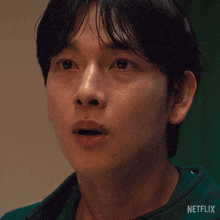 a close up of a man 's face with the word netflix on the bottom right