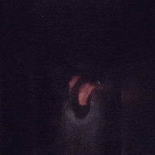 a close up of a person 's face with a pink background .