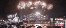 a fireworks display in sydney with the words here 's to 2024 love robyne above it