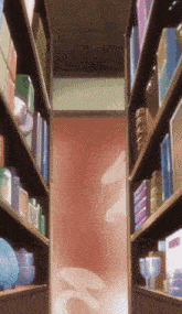 a narrow hallway with shelves filled with various items and a red wall