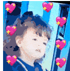 a little girl with curly hair is surrounded by pink hearts .