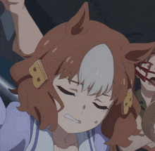 a close up of a girl with a b on her head