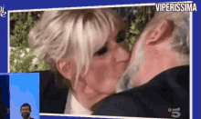 a man and a woman are kissing with the words viperissima on the bottom right