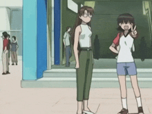 two anime girls are standing next to each other and one is giving the peace sign