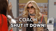 a woman wearing sunglasses is holding a drink and says coach shut it down