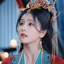 a close up of a woman wearing a crown