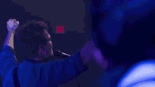 a person is playing a drum with a brush