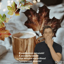 a man yawning next to a cup of coffee