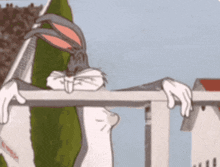 bugs bunny is leaning over a railing and looking over the railing