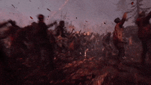 a blurred image of a crowd of people in a field