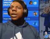 a person wearing headphones is playing a video game called creative