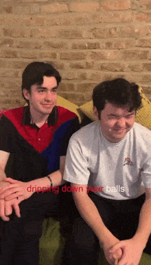 two men are sitting on a couch with the words dripping down your balls on the bottom right