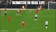 a soccer game is being played on a field with a nike ad in the background