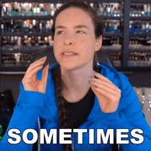 a woman in a blue jacket says " sometimes " in white letters