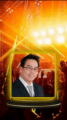 a man in a suit and tie is standing in front of a crowd at a concert