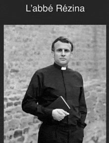 a black and white photo of a priest holding a bible with the name l' abbe rezina above him