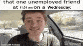 a young man is sitting in the driver 's seat of a car .