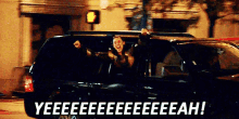 a man is getting out of a car with the words yeeeeeeeeeeeeah written on the bottom